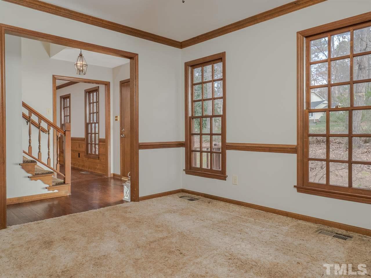 8317 Druids Lane Raleigh, NC 27613 - Photo 8 of 24 Flex space downstairs could be used as a formal dining room or as an office or living room.