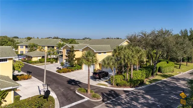an aerial view of houses with trees