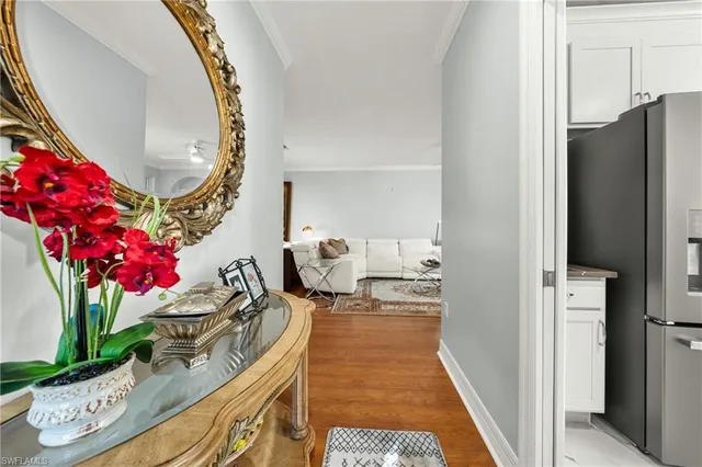 a view of living room with furniture and a fireplace