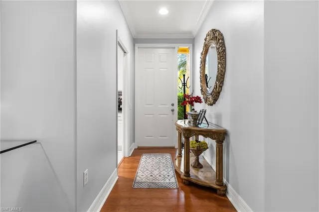 a picture of a hallway with wooden floor