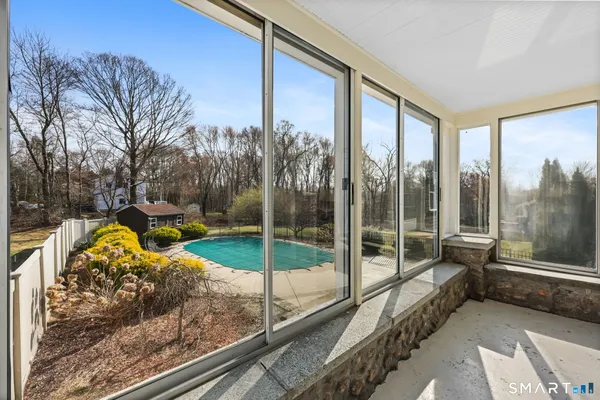 a kitchen with stainless steel appliances granite countertop a sink a stove and a wooden floors