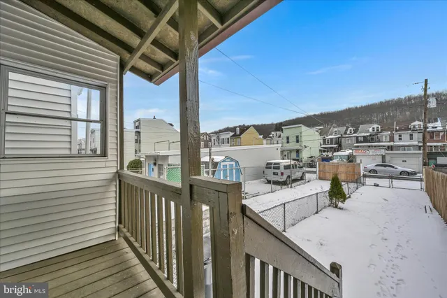 a view of a balcony with chairs