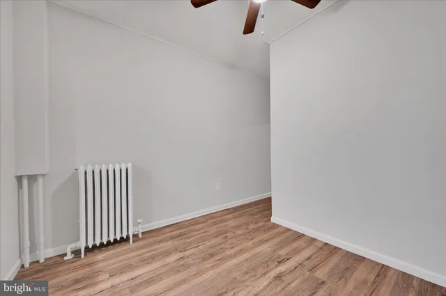 a view of room with wooden floor