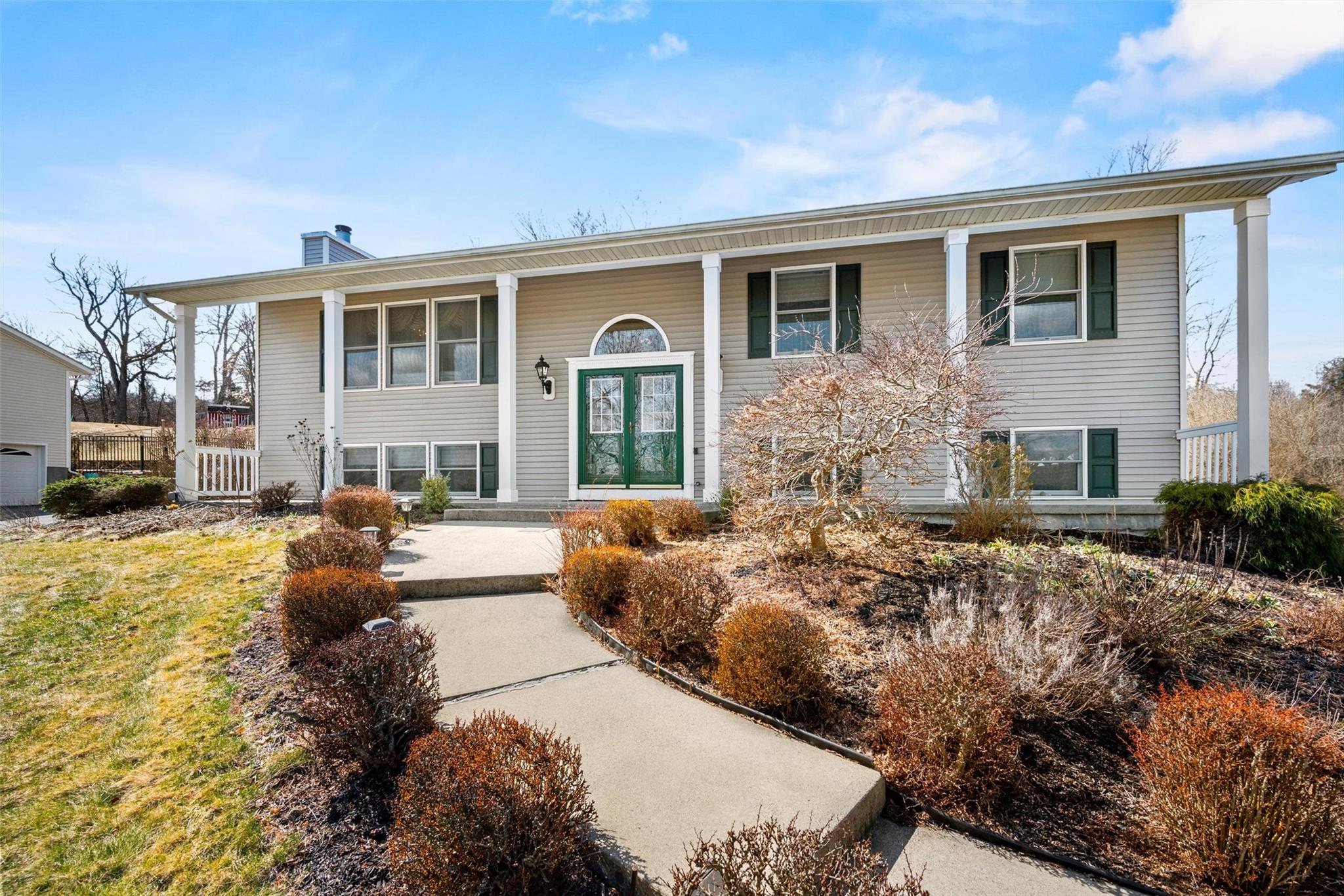 a front view of a house with a yard