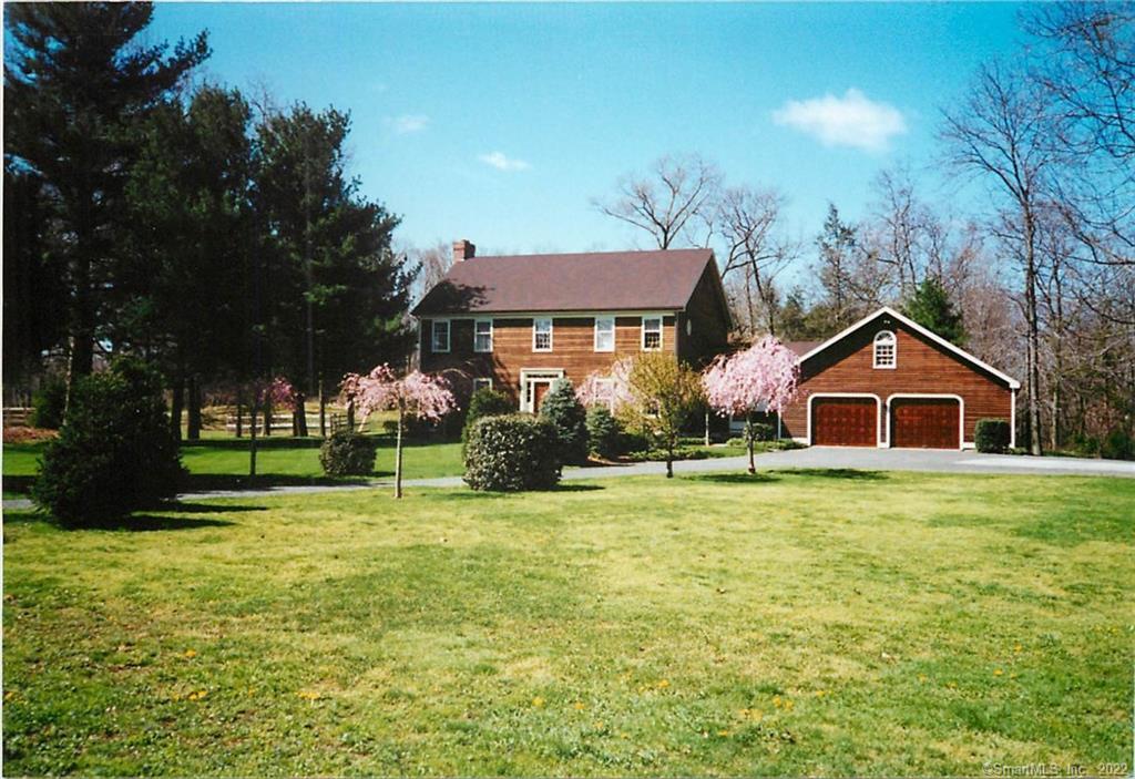628 Lambert Road Orange, CT 06477 - Photo 1 of 1 a front view of a house with a yard