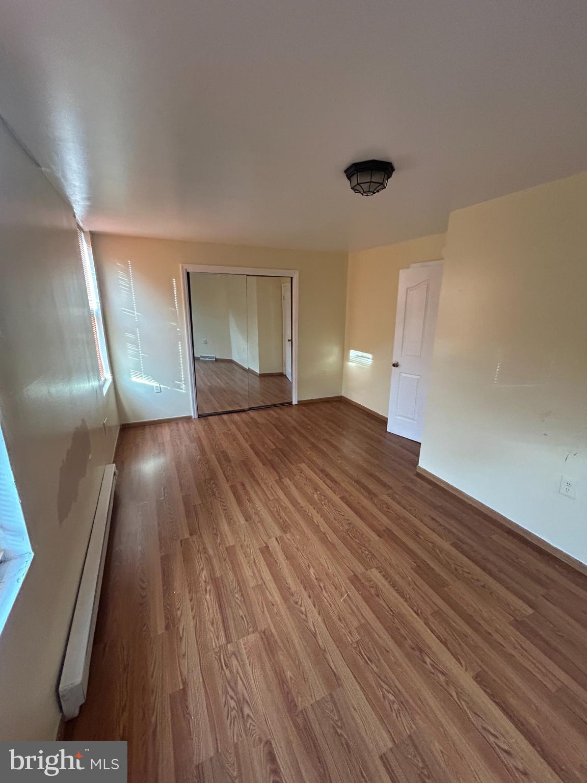 349 Pearl Street Reading, PA 19602 - Photo 14 of 17 Bright, spacious room with warm wood floors.