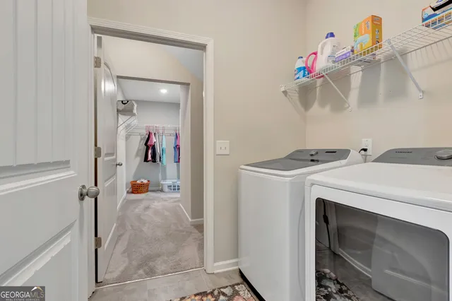 a utility room with dryer and washer