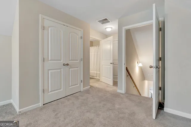 an empty room with a mirror