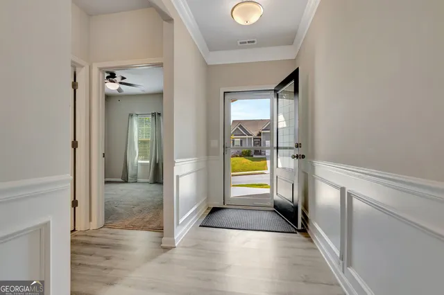 a view of a kitchen from the hallway