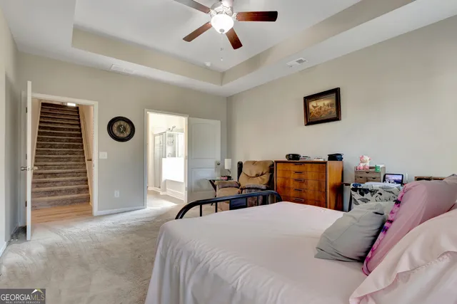 a bed room with a bed and a chandelier