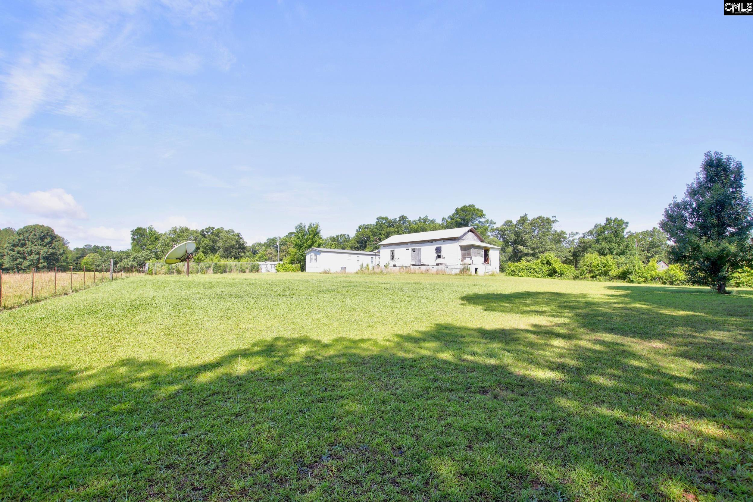 3140 Highway 702 Chappells, SC 29037 - Photo 17 of 39 a view of a lake with houses