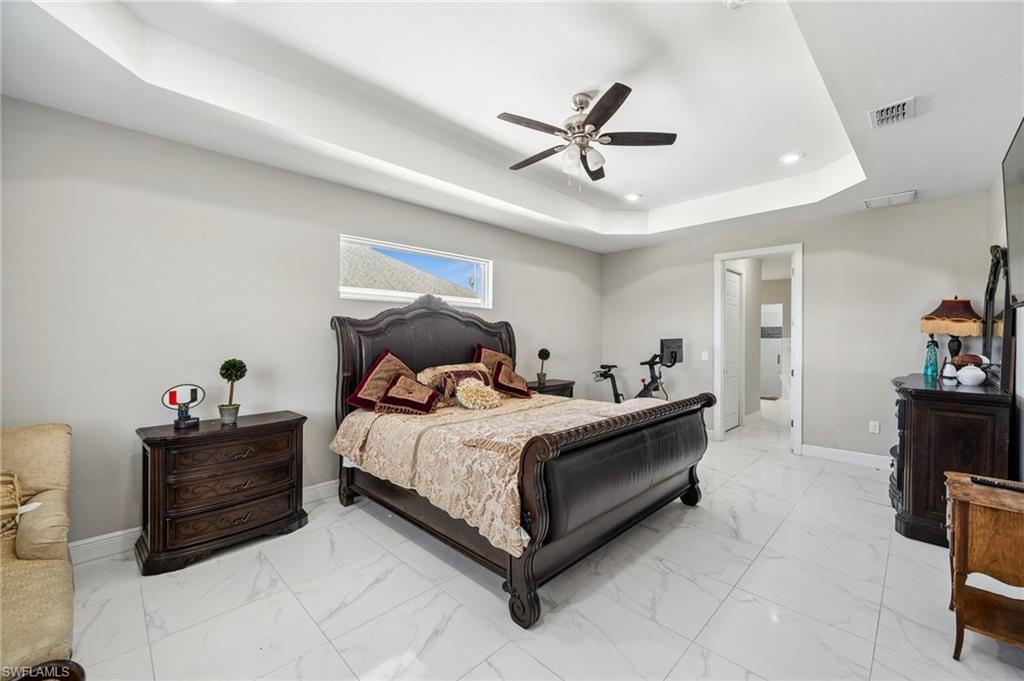 3407 20th Street Southwest Lehigh Acres, FL 33976 - Photo 12 of 23 a bed room with a bed and furniture