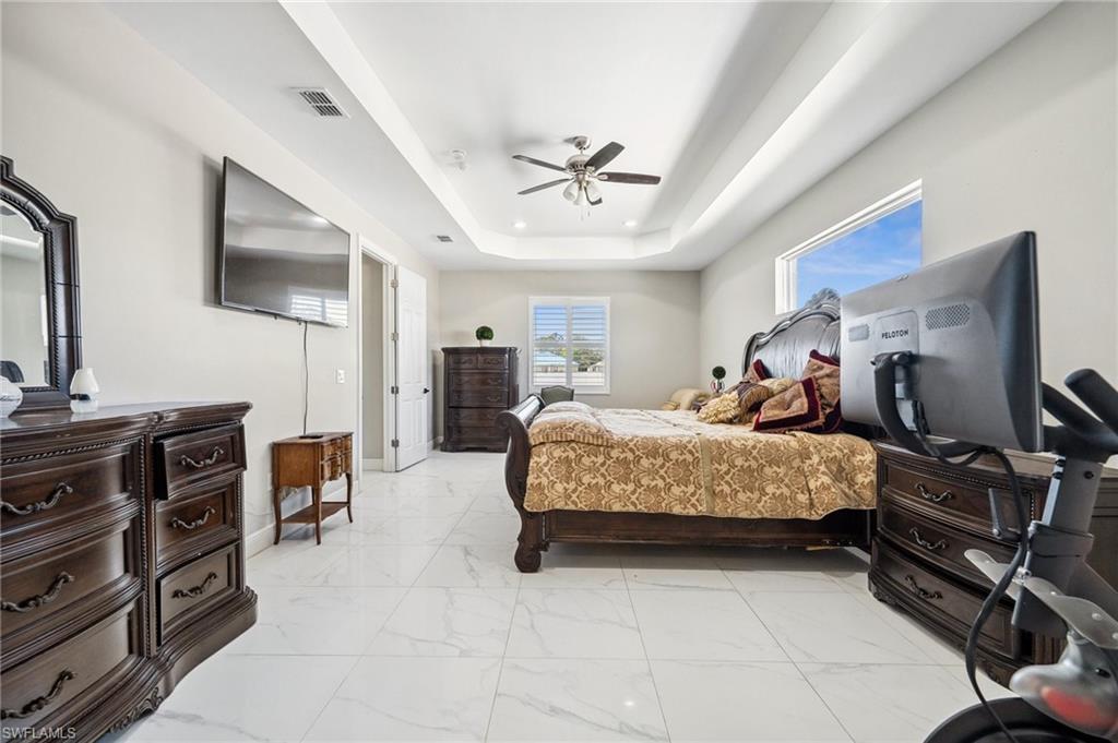 3407 20th Street Southwest Lehigh Acres, FL 33976 - Photo 13 of 23 a bedroom with a bed and furniture