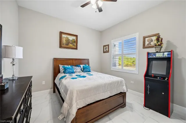 a bedroom with a bed and a lamp on table