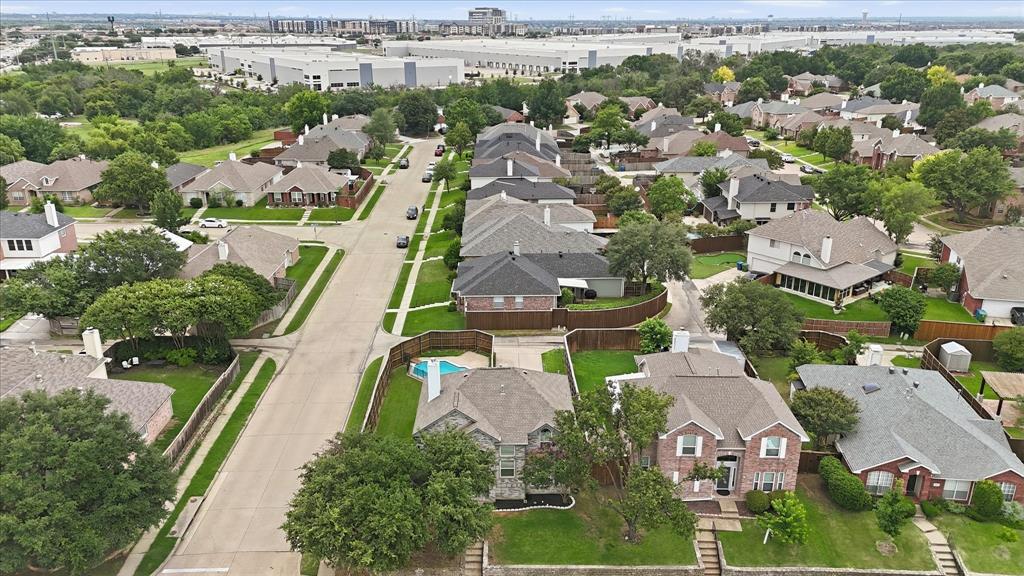 4545 Ridgepointe Drive The Colony, TX 75056 - Photo 36 of 37 Aerial perspective of a residential neighborhood featuring detached homes on tree-lined streets with sidewalks
