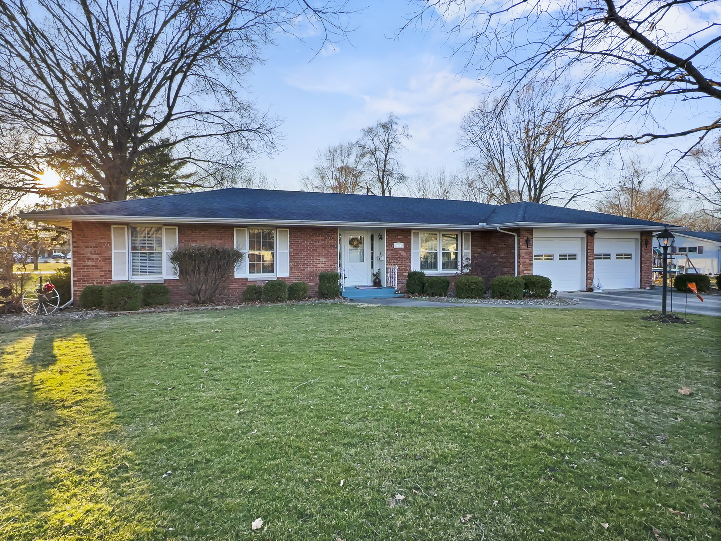 447 South Ralph Street Watseka, IL 60970 - Photo 2 of 20 a front view of a house with a yard and trees