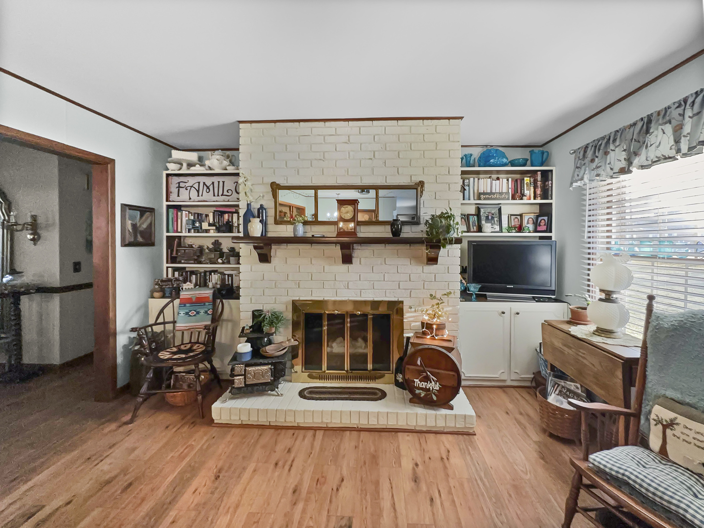 447 South Ralph Street Watseka, IL 60970 - Photo 7 of 20 a living room with furniture and a fireplace