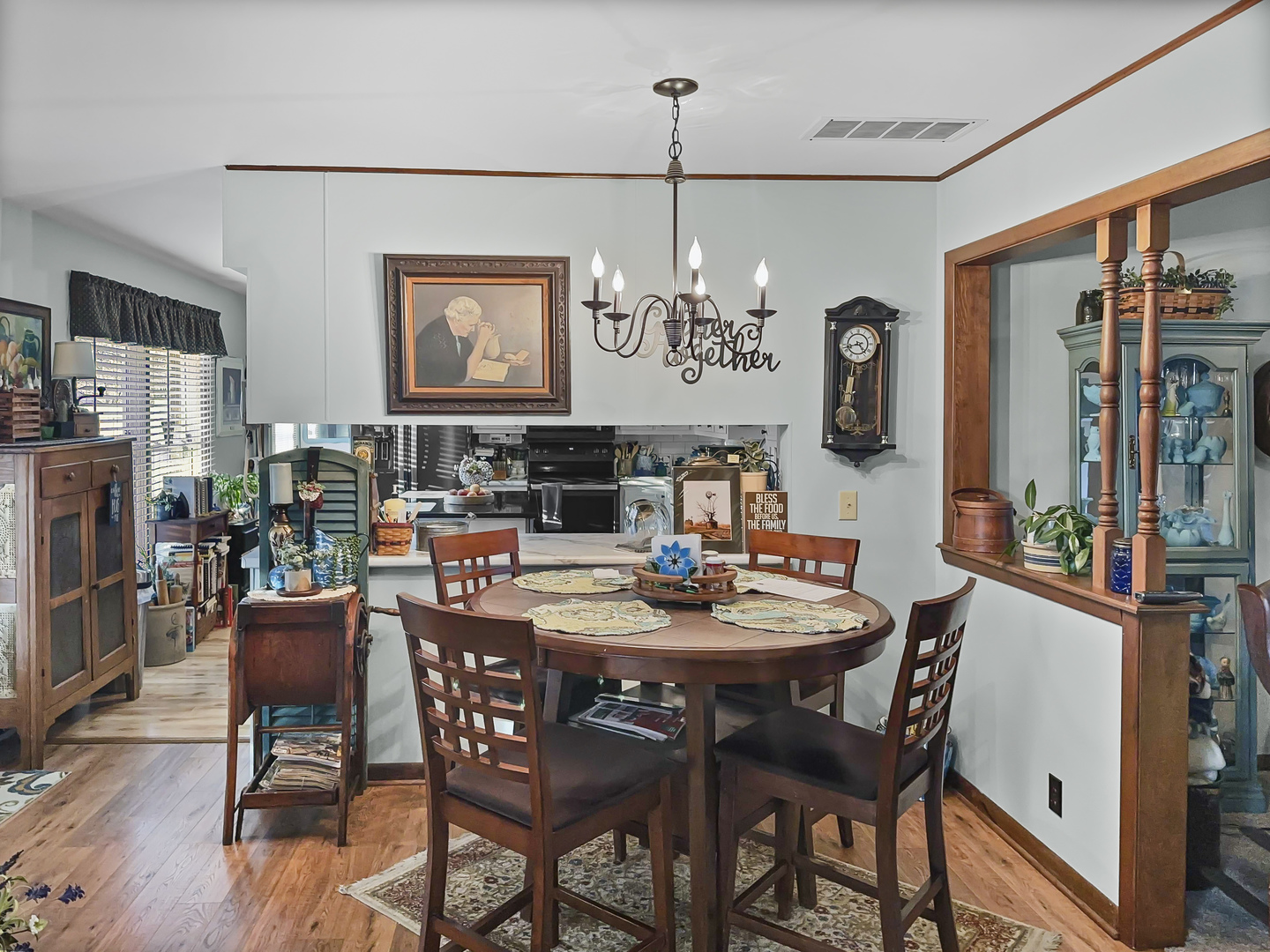 447 South Ralph Street Watseka, IL 60970 - Photo 8 of 20 a view of a dining room with furniture a chandelier and wooden floor