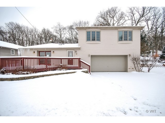 35W503 Riverside Drive St. Charles, IL 60174 - Photo 1 of 10 a view of a house with a roof deck