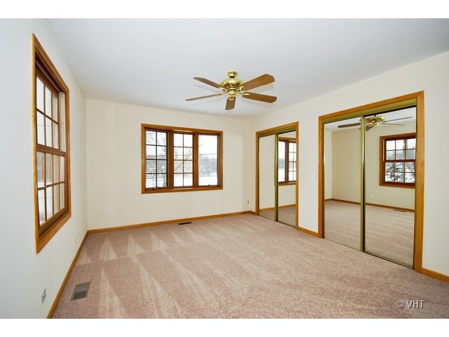 35W503 Riverside Drive St. Charles, IL 60174 - Photo 7 of 10 a view of an empty room with chandelier fan and a window
