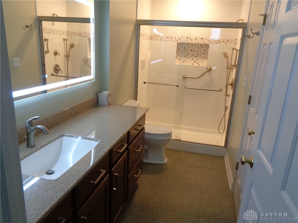 80 Villa Pointe Drive Springboro, OH 45066 - Photo 13 of 19 This bathroom features a contemporary vanity with a sleek sink and a spacious shower.