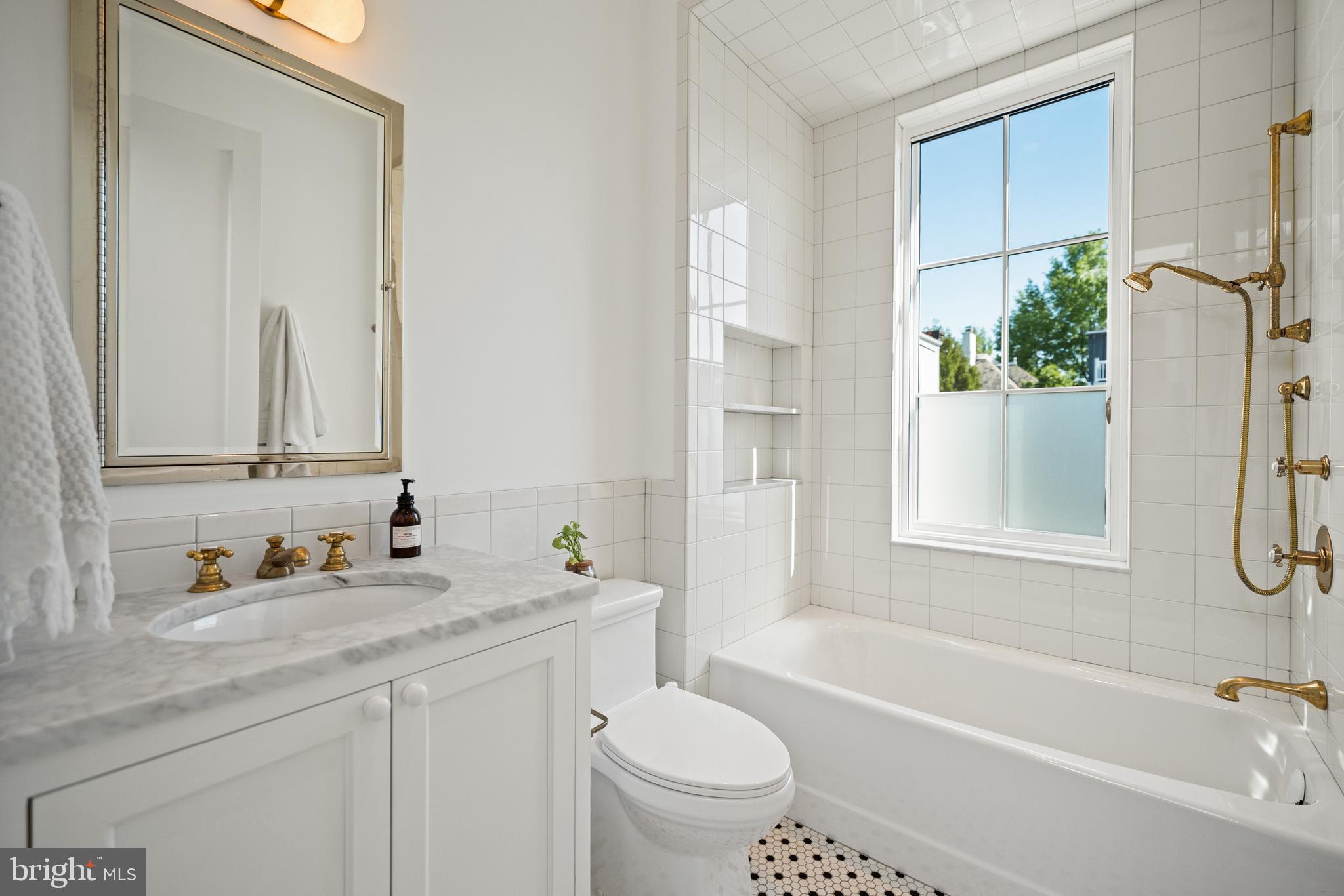 1304 S Street Northwest Washington, DC 20009 - Photo 14 of 23 a bathroom with a granite countertop sink toilet and shower
