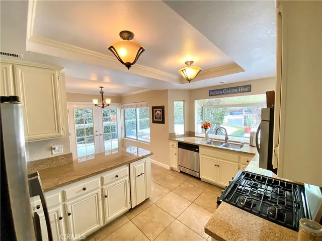 a kitchen with sink and cabinets