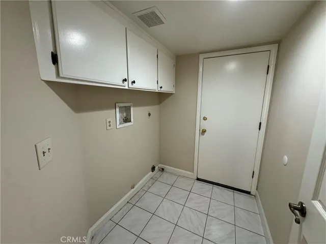 a view of a kitchen with cabinets