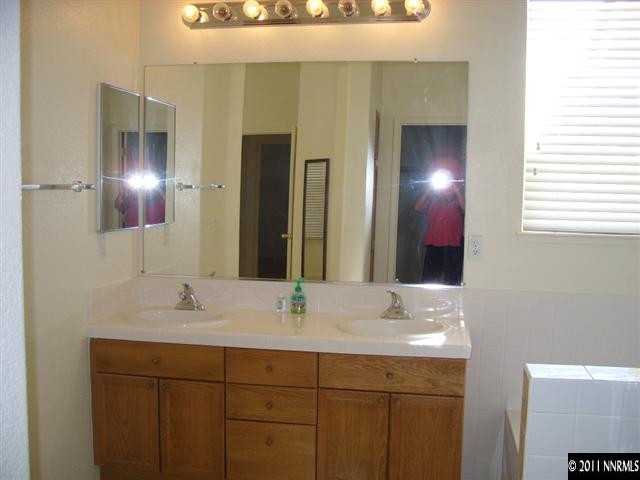 1765 Canyonlands Way Reno, NV 89521 - Photo 9 of 12 a bathroom with a sink and a mirror