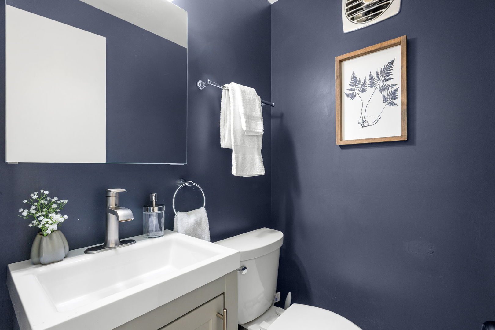 2101 Pioneer Road Evanston, IL 60201 - Photo 14 of 36 a bathroom with a toilet sink and mirror