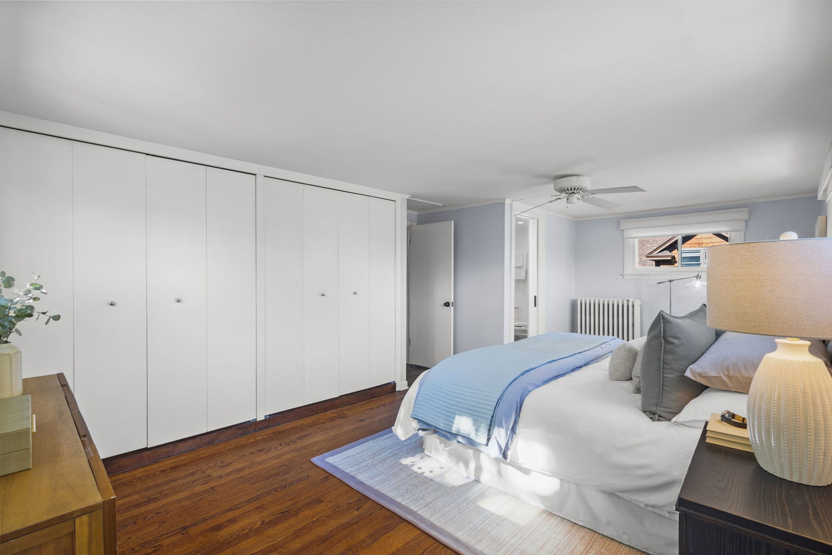 2101 Pioneer Road Evanston, IL 60201 - Photo 16 of 36 a bedroom with a bed and wooden floor