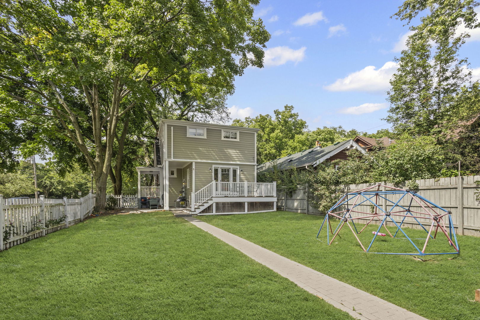 2101 Pioneer Road Evanston, IL 60201 - Photo 30 of 36 a view of a house with a big yard and large trees