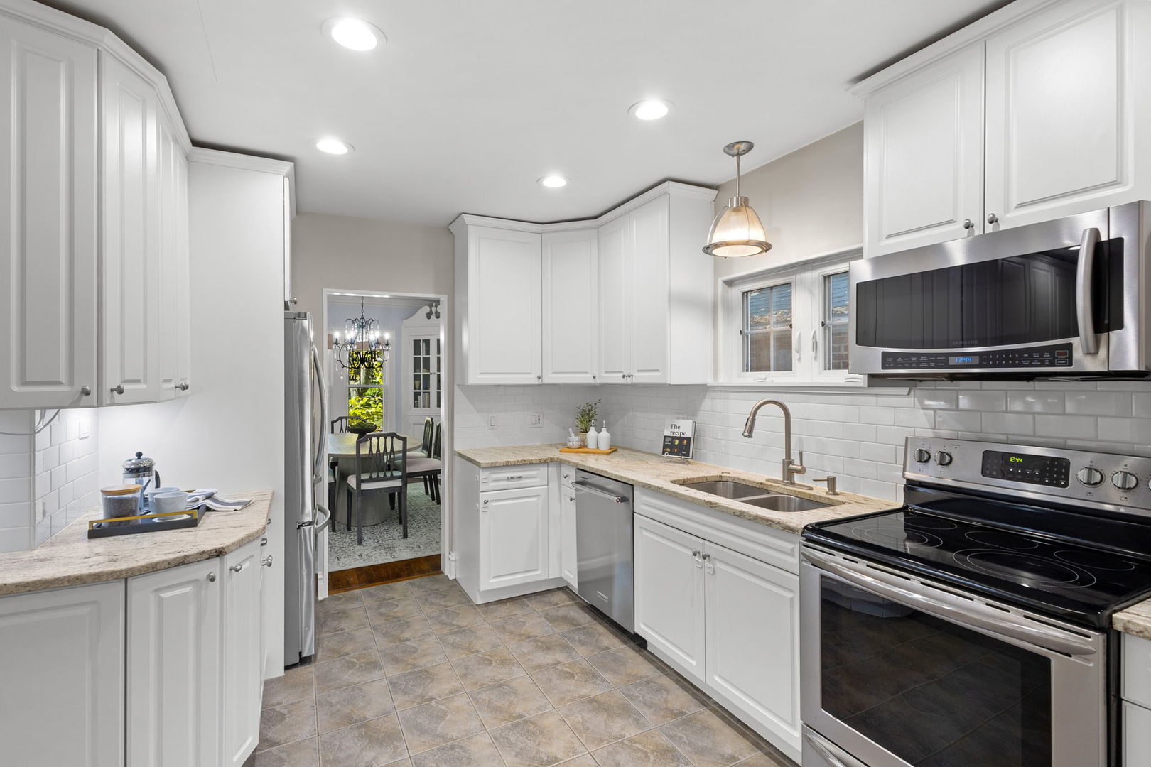 2101 Pioneer Road Evanston, IL 60201 - Photo 8 of 36 a kitchen with stainless steel appliances a stove sink microwave and cabinets