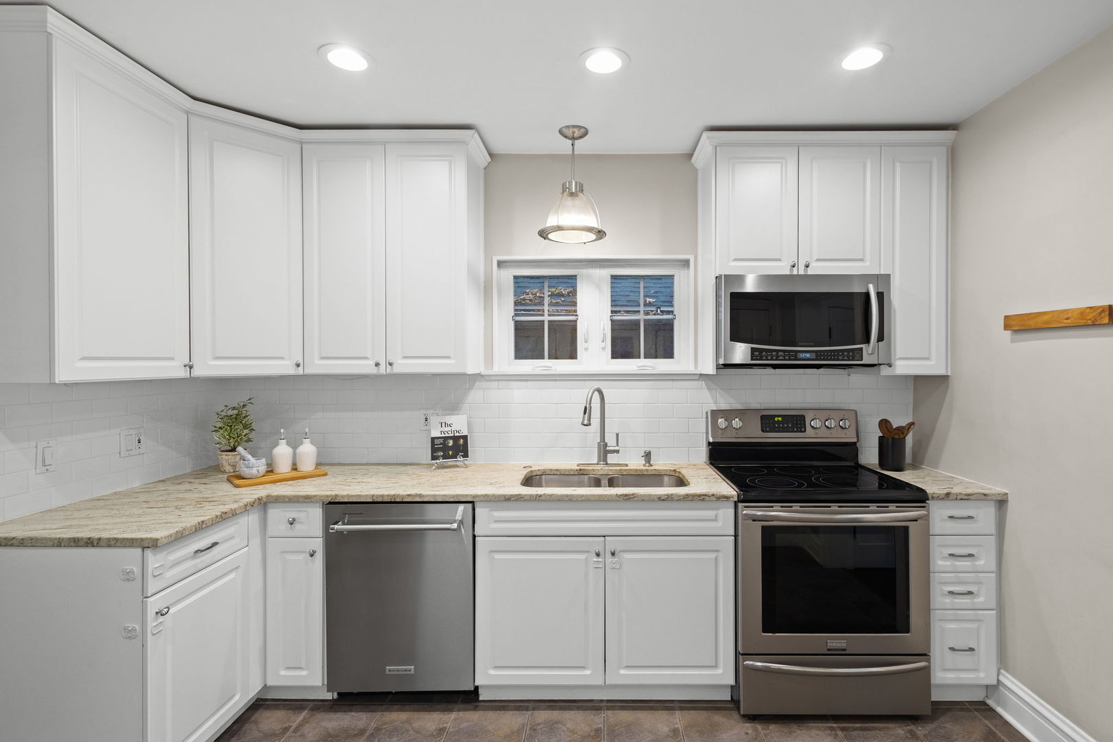 2101 Pioneer Road Evanston, IL 60201 - Photo 9 of 36 a kitchen with stainless steel appliances a stove a sink and a microwave