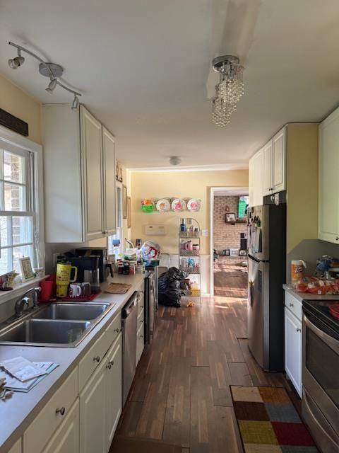 324 Piper Road Covington, GA 30014 - Photo 11 of 19 a kitchen with a sink appliances cabinets and a counter space