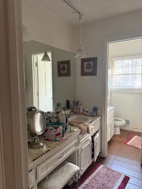 324 Piper Road Covington, GA 30014 - Photo 14 of 19 a en suite bathroom with a granite countertop toilet and a sink