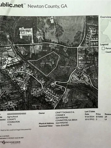 a view of a yard with a car parked in it