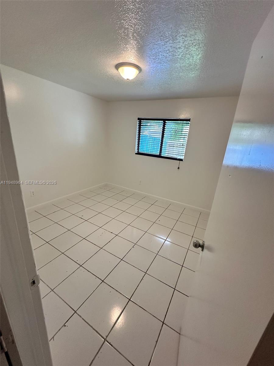 13993 Southwest 280th Terrace Homestead, FL 33033 - Photo 11 of 22 a view of an empty room
