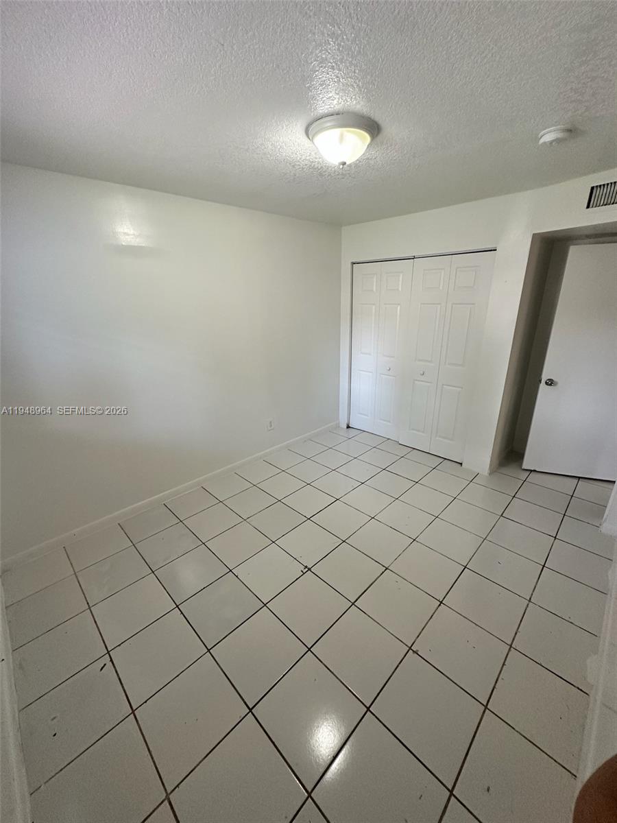 13993 Southwest 280th Terrace Homestead, FL 33033 - Photo 14 of 22 a view of an empty room
