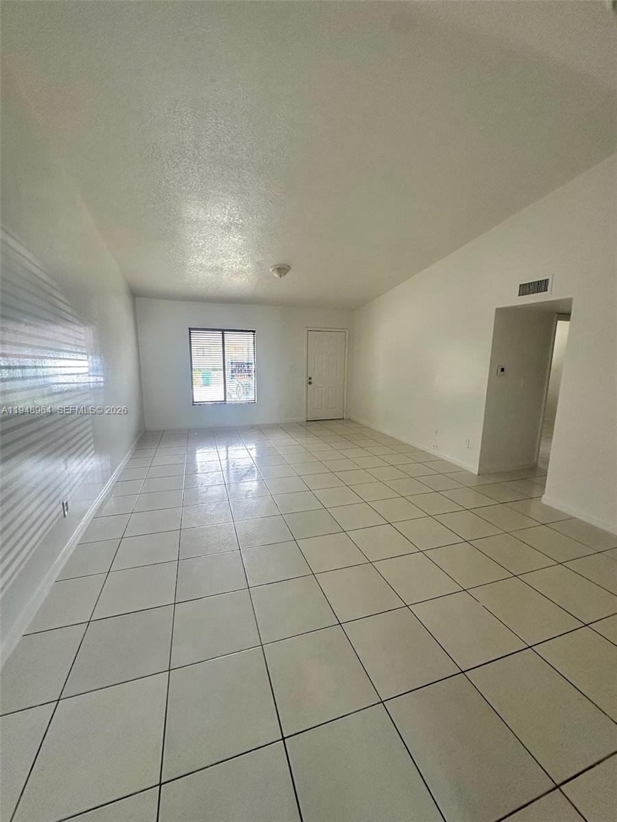 13993 Southwest 280th Terrace Homestead, FL 33033 - Photo 15 of 22 a view of an empty room and window