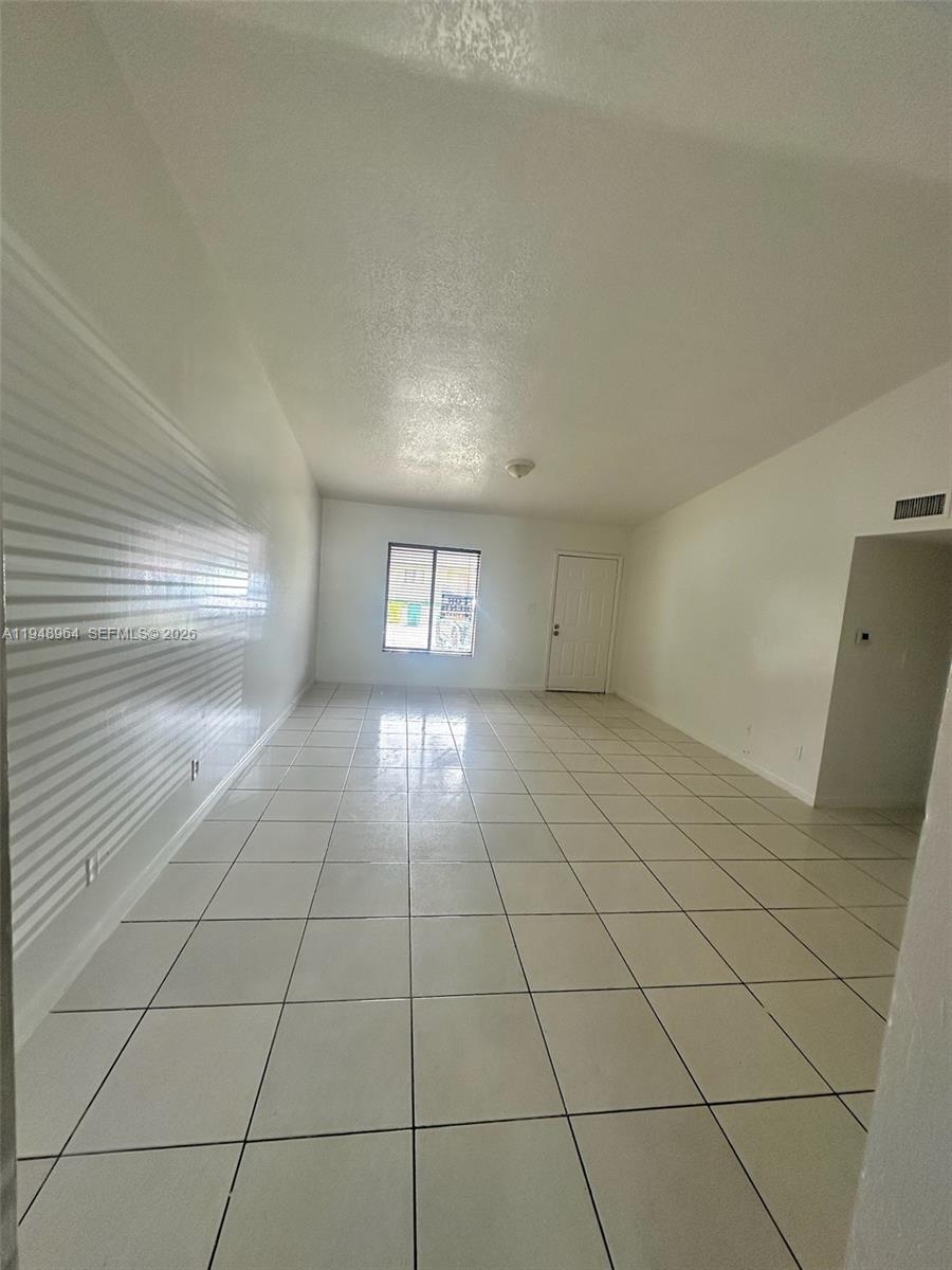 13993 Southwest 280th Terrace Homestead, FL 33033 - Photo 16 of 22 a view of an empty room and window