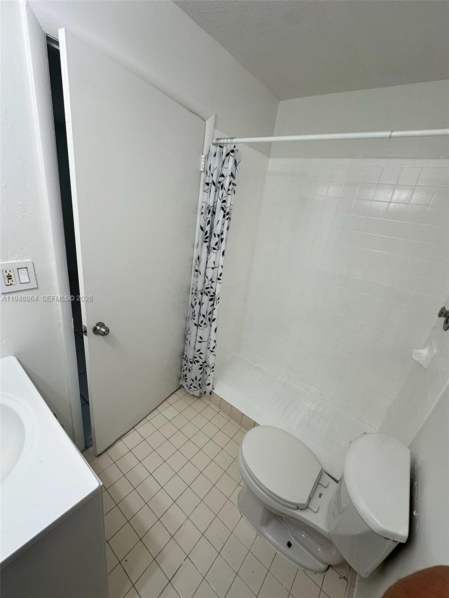 13993 Southwest 280th Terrace Homestead, FL 33033 - Photo 4 of 22 a bathroom with a toilet and a shower