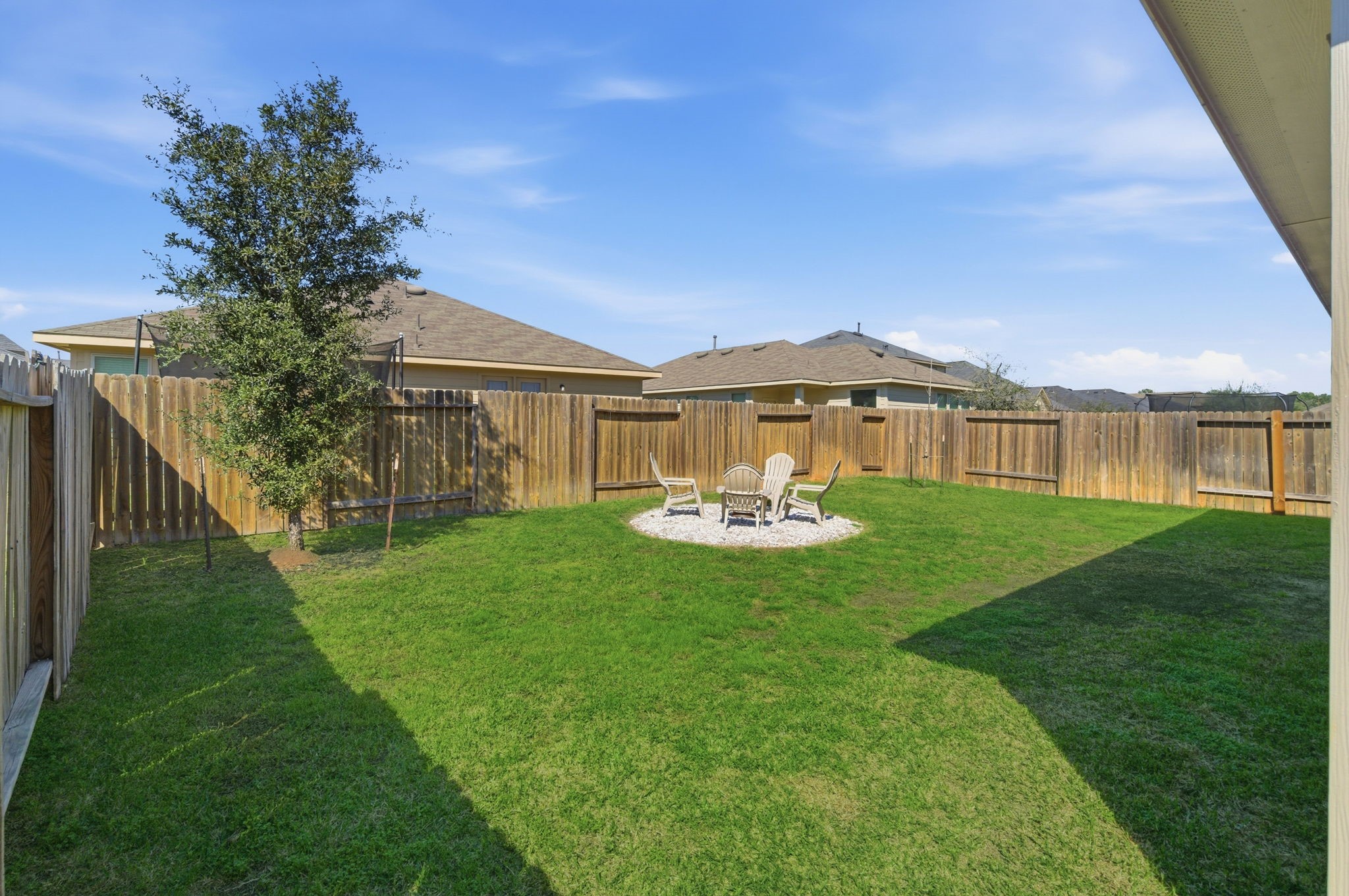 2121 Cedar Way Drive Conroe, TX 77301 - Photo 25 of 27 a view of a house with a yard