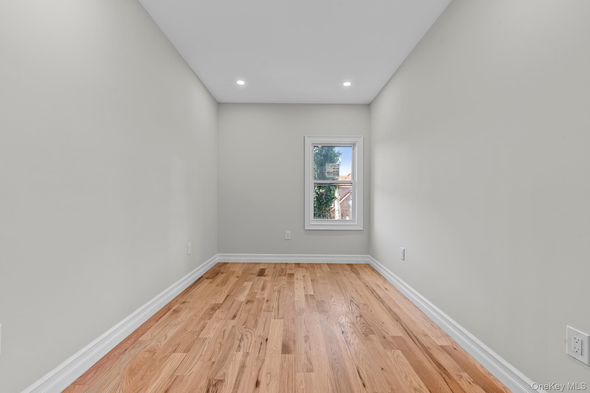 179-18 Selover Road Queens, NY 11434 - Photo 14 of 18 Spare room with light wood finished floors and recessed lighting