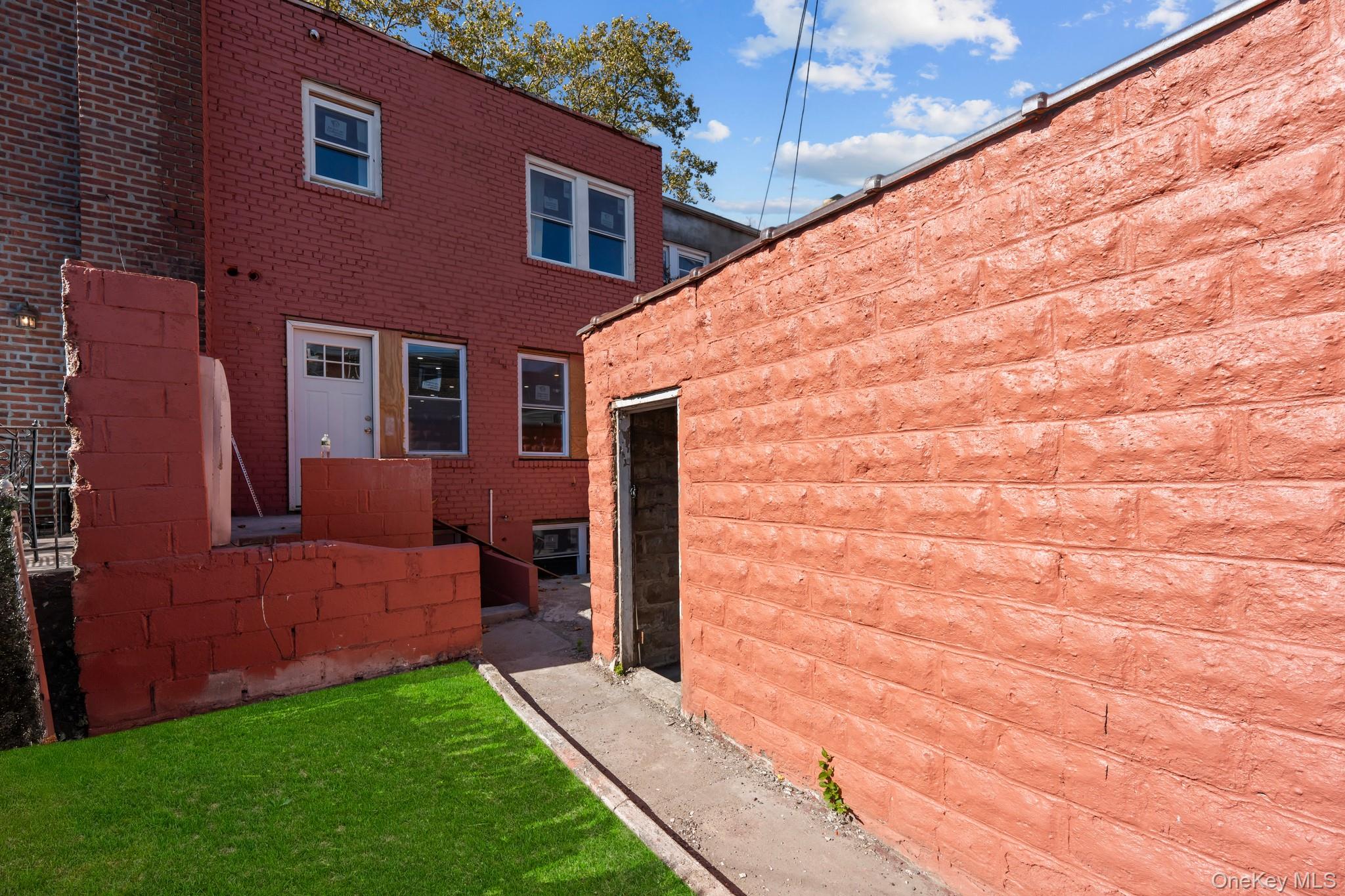 179-18 Selover Road Queens, NY 11434 - Photo 17 of 18 View of property exterior with brick siding and a lawn