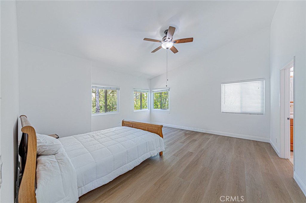 25533 Longfellow Place Stevenson Ranch, CA 91381 - Photo 21 of 47 a bedroom with a bed and a window