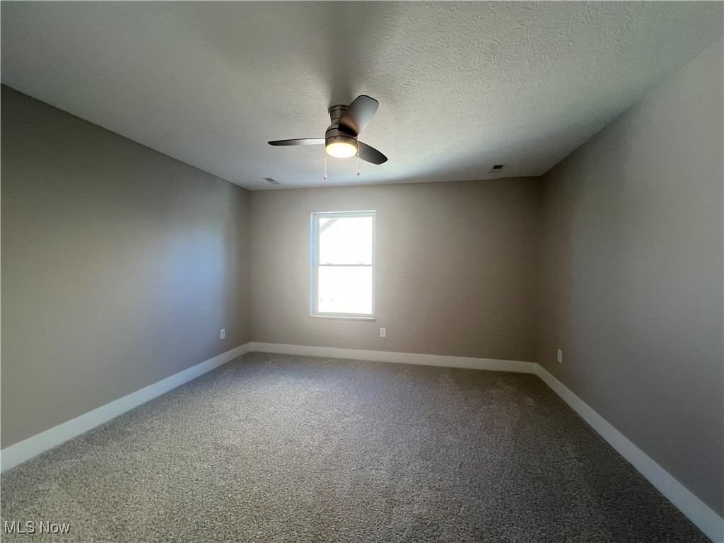 3370 Nagel Road Avon, OH 44011 - Photo 26 of 30 Carpeted empty room featuring ceiling fan and a textured ceiling