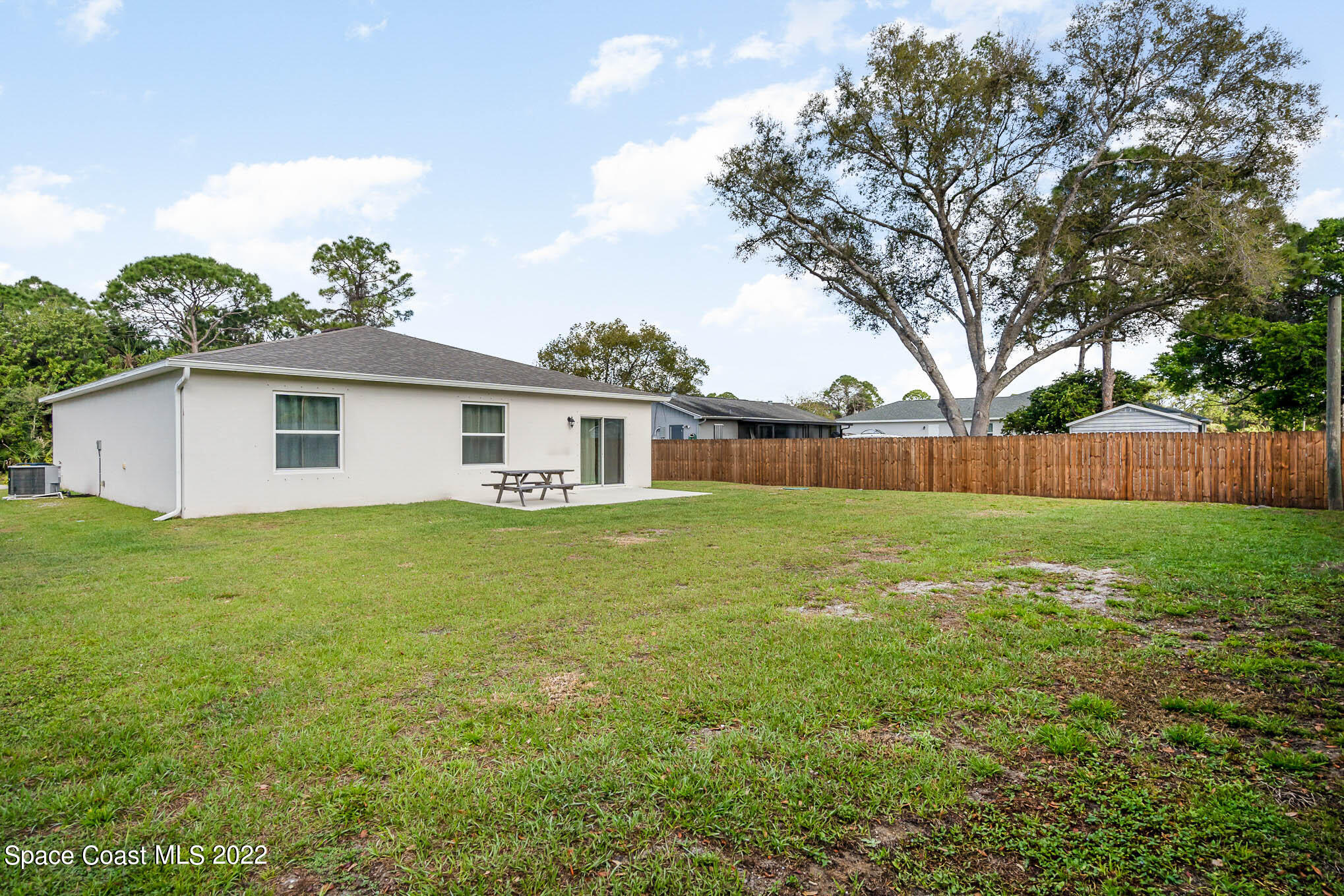 1061 Wabash Road Southeast Palm Bay, FL 32909 - Photo 19 of 22 a front view of house with yard and green space