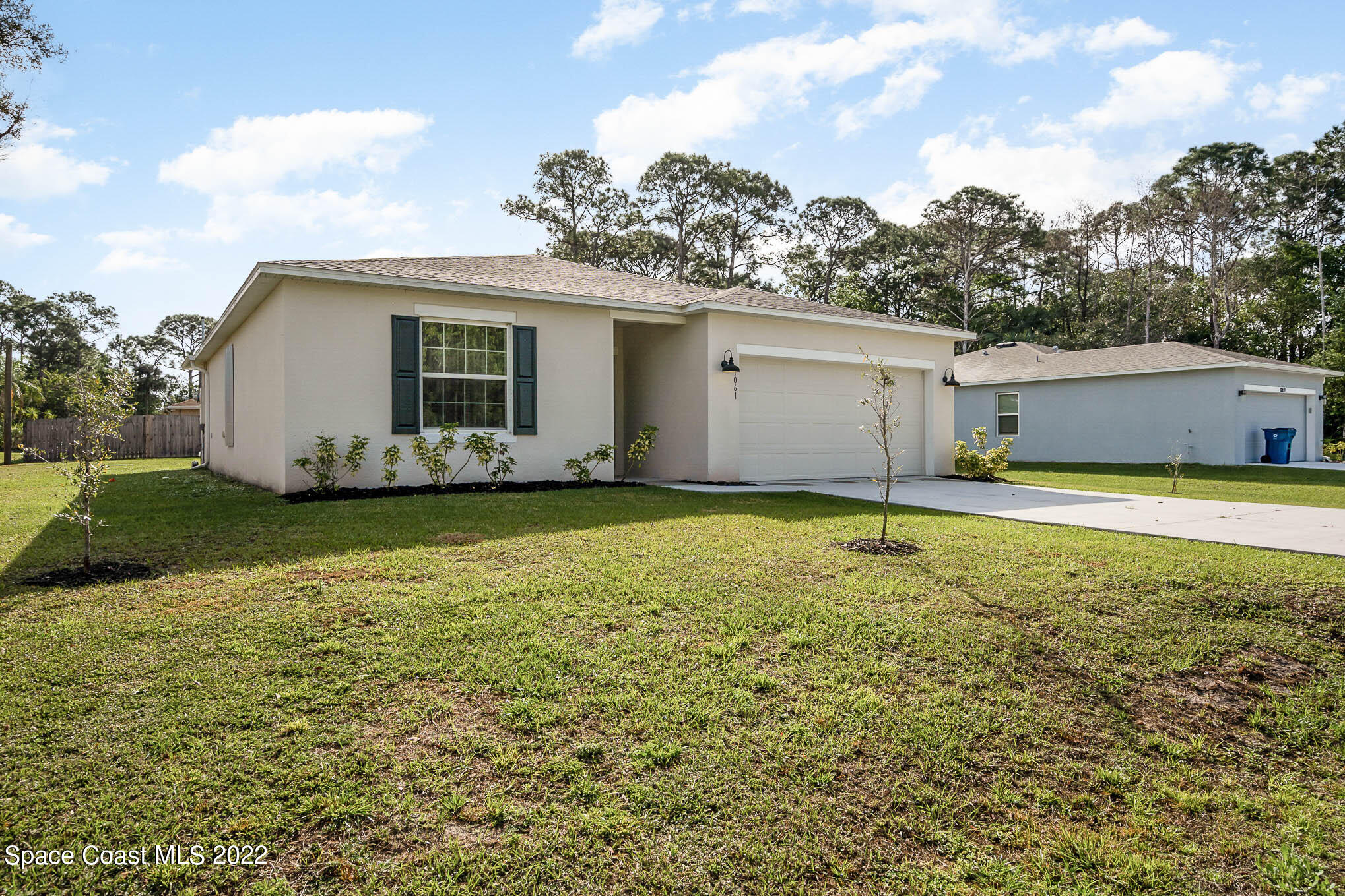 1061 Wabash Road Southeast Palm Bay, FL 32909 - Photo 2 of 22 a view of a house with yard