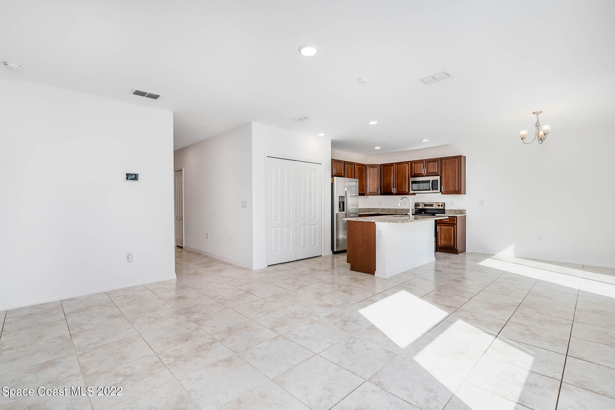 1061 Wabash Road Southeast Palm Bay, FL 32909 - Photo 4 of 22 a view of a kitchen with a sink